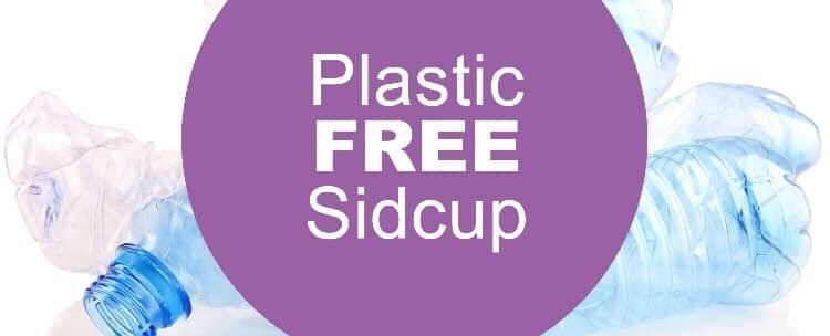 Plastic free Sidcup purple banner with plastic bottles in the background.