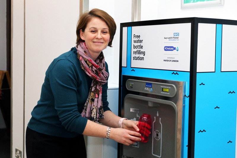 Woman refilling her bottle from the new indoor bottle refill station at Guy’s and St. Thomas’ Hospital.