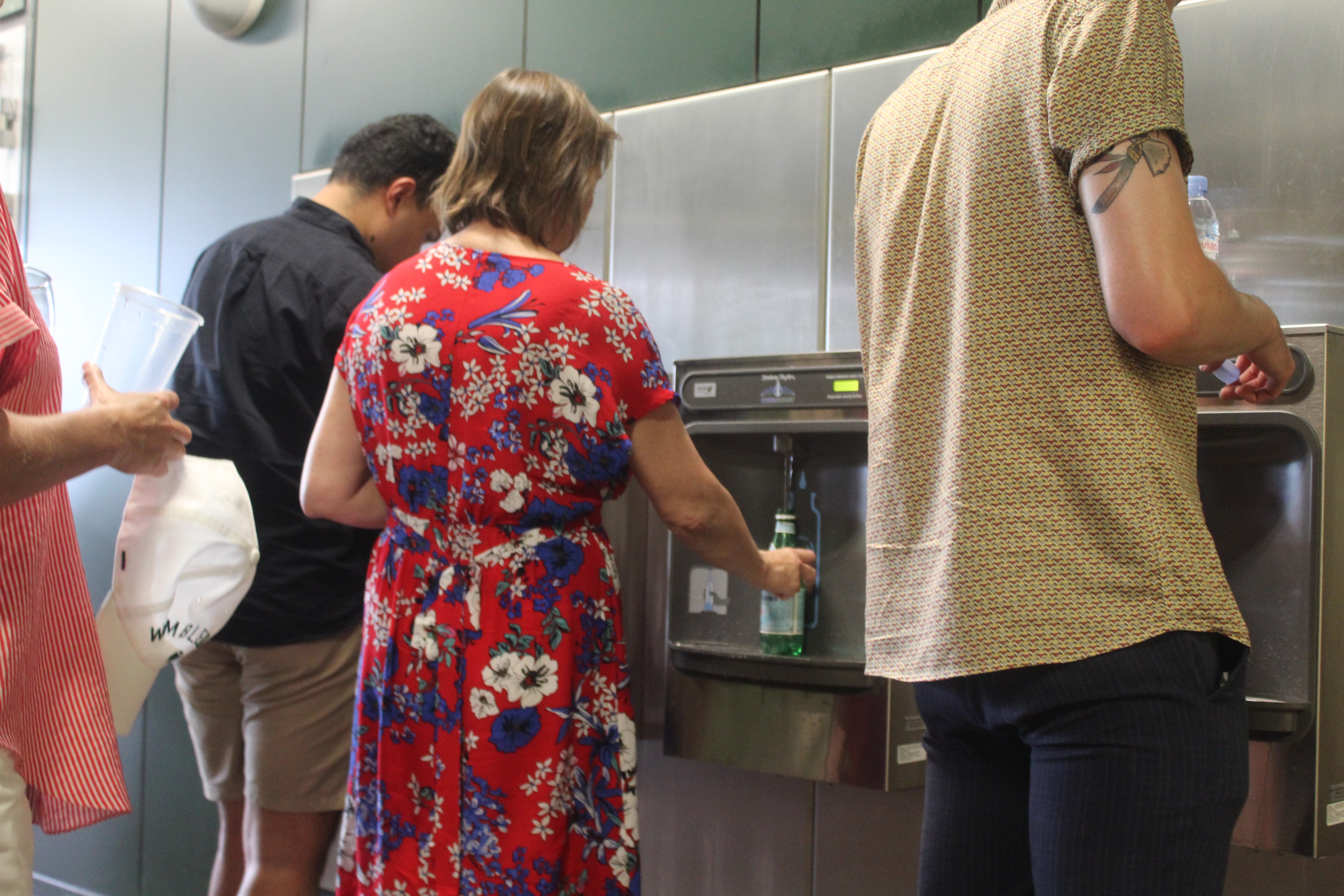 Wimbledon fans refilling their water bottles. 