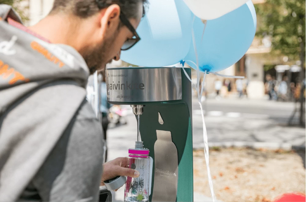 A man refilling his water bottle at the new bottle refill station in Vilnius