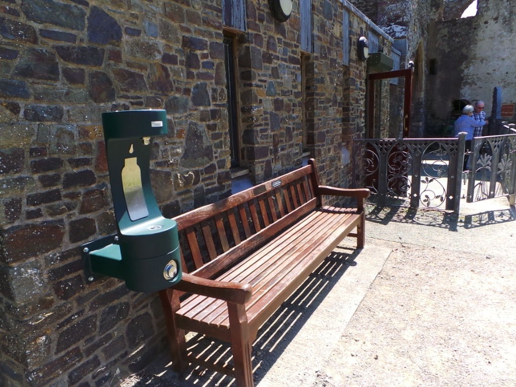 New green outdoor bottle refill station at St Davids Bishop's Palace.