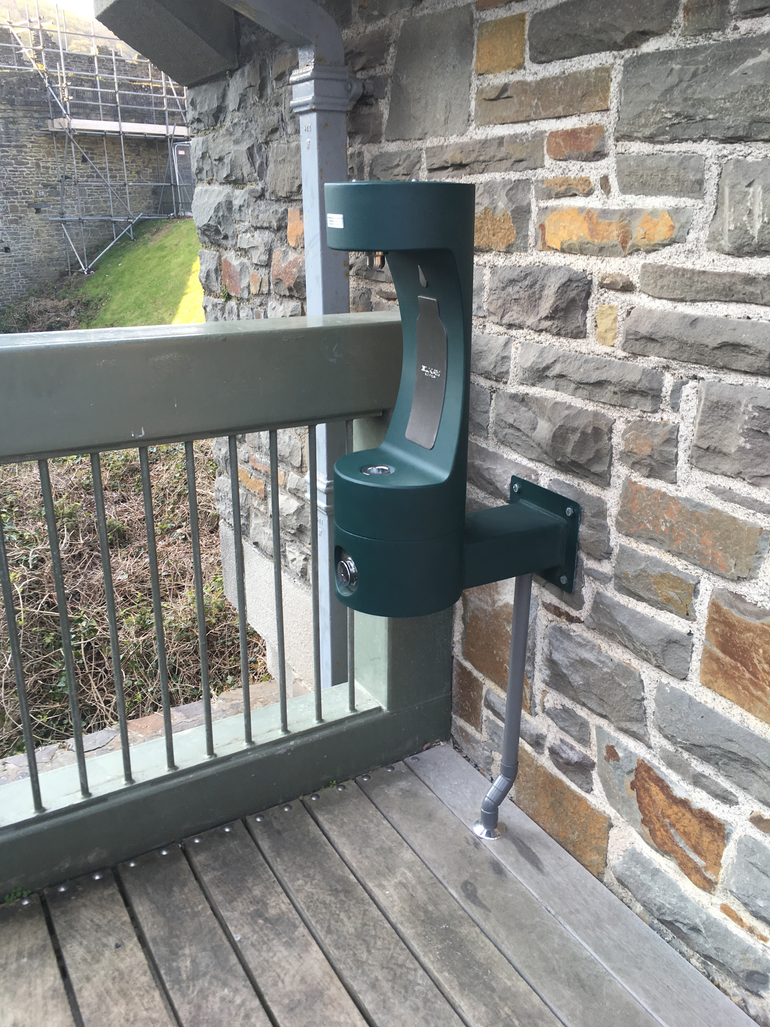 Newly installed green drinking fountain near visitor centre in Conwy Castle