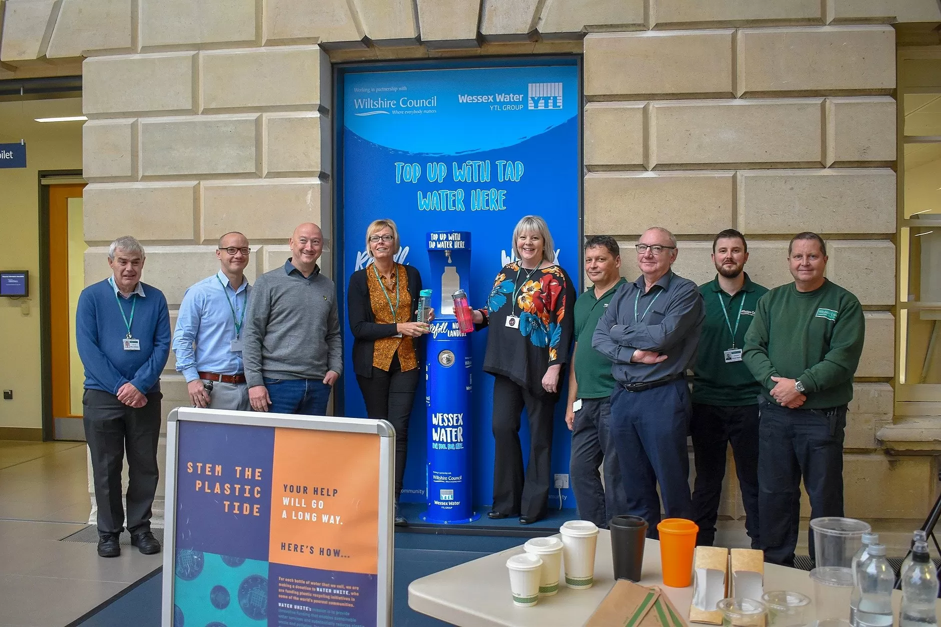Happy people posing with the new Wessex Water bottle filler