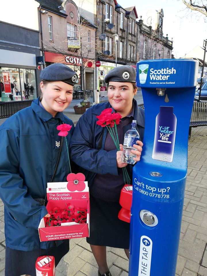 Women posing next to the new Scottish Water drinking fountain