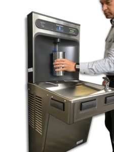 A image of a person using a contactless water bottle refill station